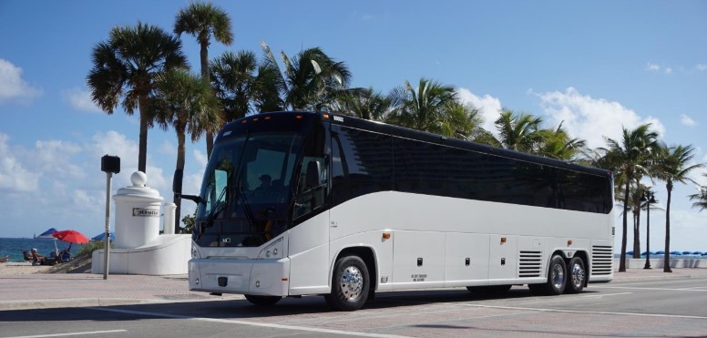 TWO NEW MOTOR COACHES