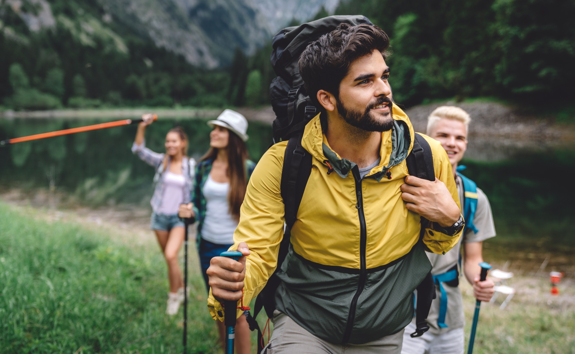Group of friends on a hiking, camping trip in the mountains